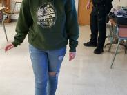 Officer observing a student walk a line